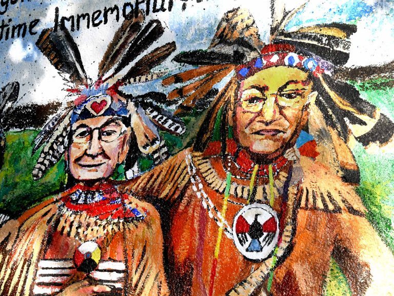 A closeup of the Land Acknowledgement mural depicting brothers Lee Braveheart and Harry the Hawk Edmonds